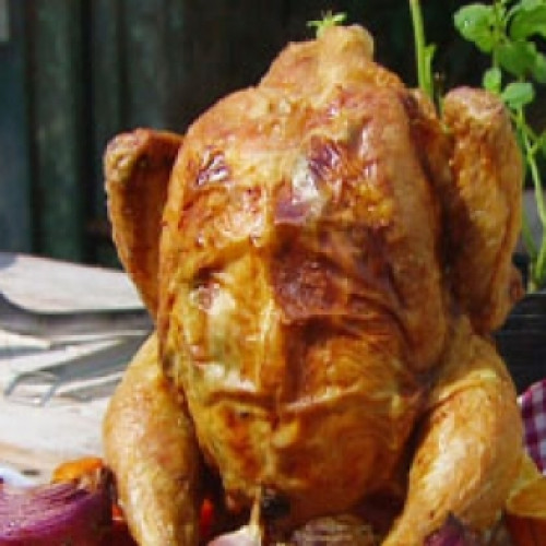 Pollo sentado al horno de barro con vegetales asados